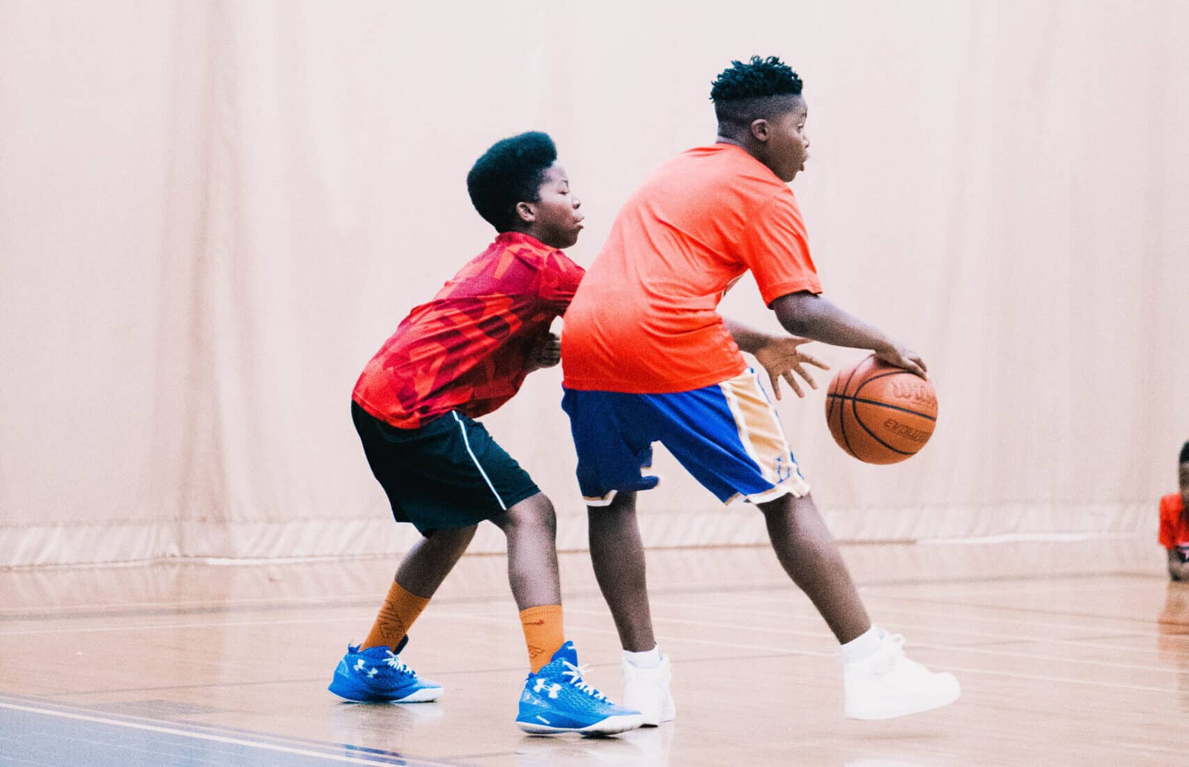 Two black boys playing basketball at the A4H Sports camp