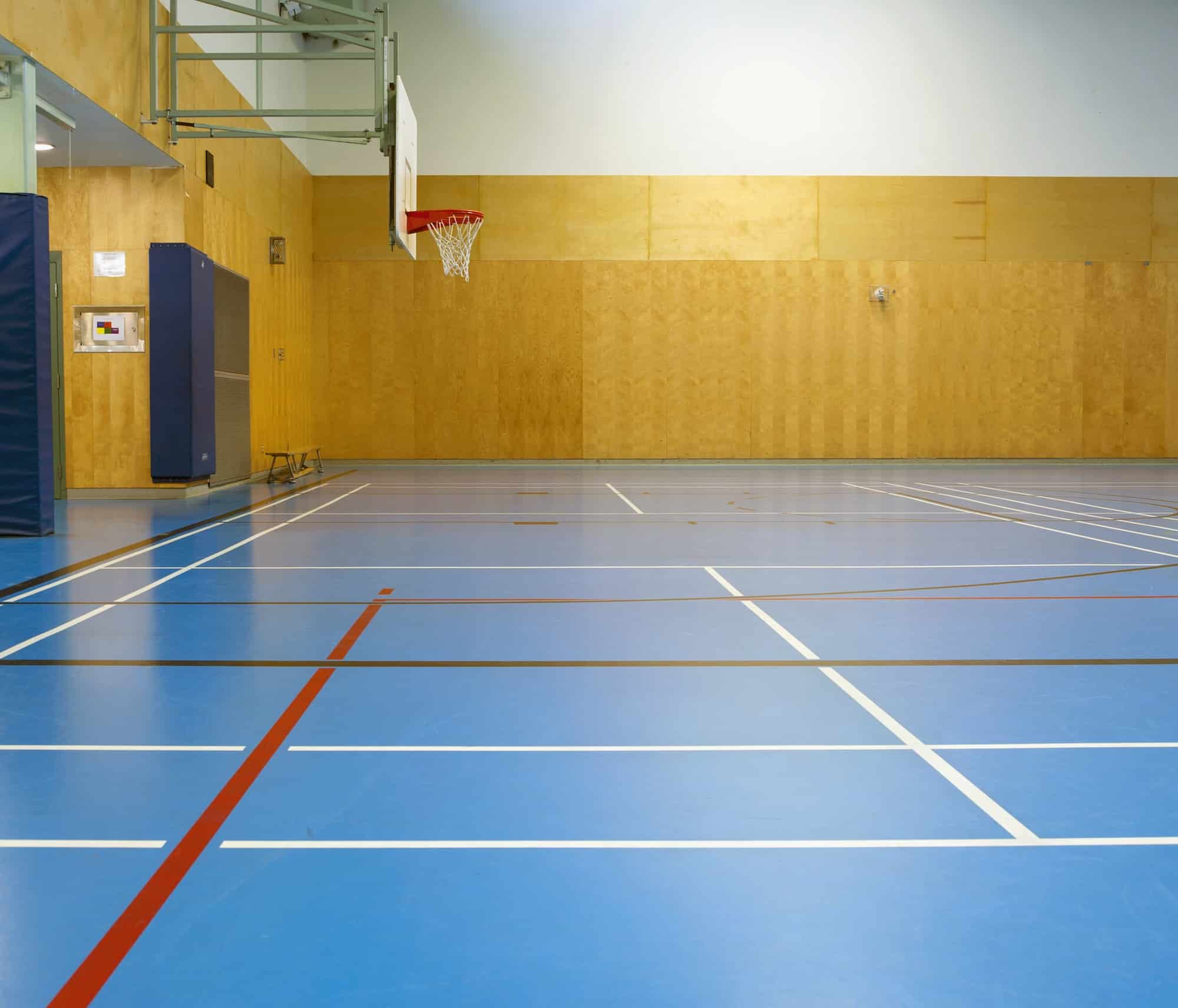 Gymnasium and basketball court, large empty gym.