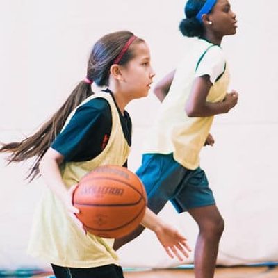 white girl bouncing basketball