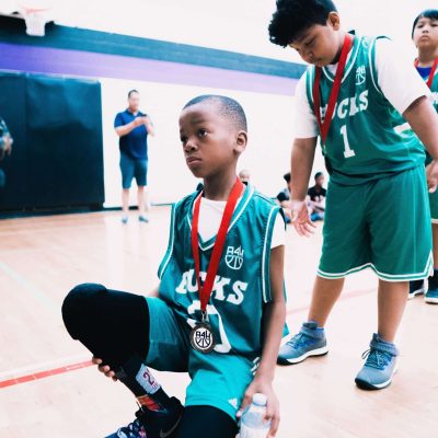 basketball kids with medals round their necks